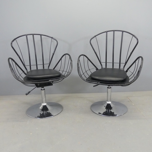 2532 - A pair of butterfly design swivel chairs, the painted tubular metal frame on chrome base with rise a... 