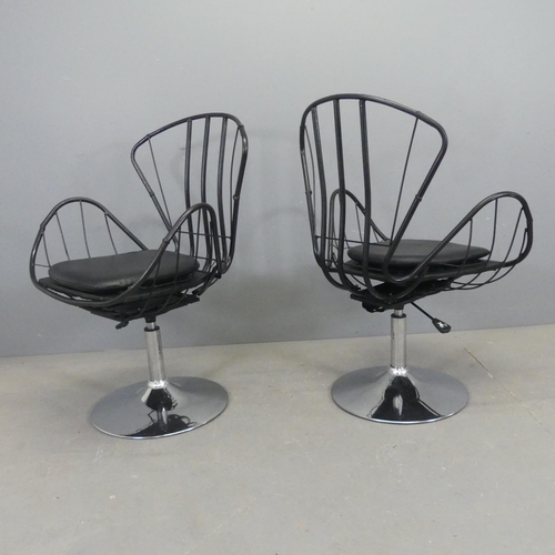 2532 - A pair of butterfly design swivel chairs, the painted tubular metal frame on chrome base with rise a... 