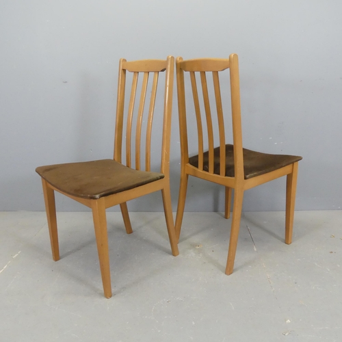 2534 - A set of four modern beech and upholstered dining chairs.