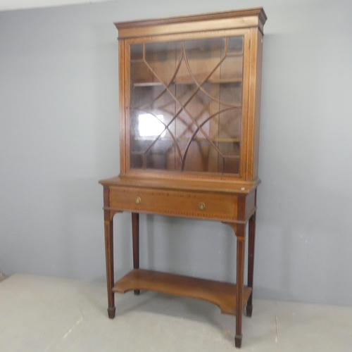 2542 - An Edwardian cross-banded mahogany and satinwood strung two-section bookcase on stand, with lattice ... 