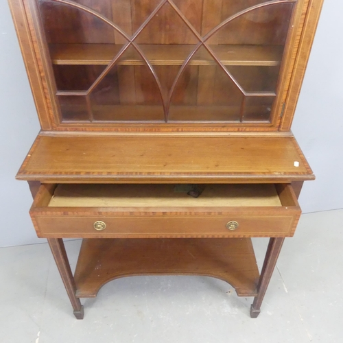 2542 - An Edwardian cross-banded mahogany and satinwood strung two-section bookcase on stand, with lattice ... 