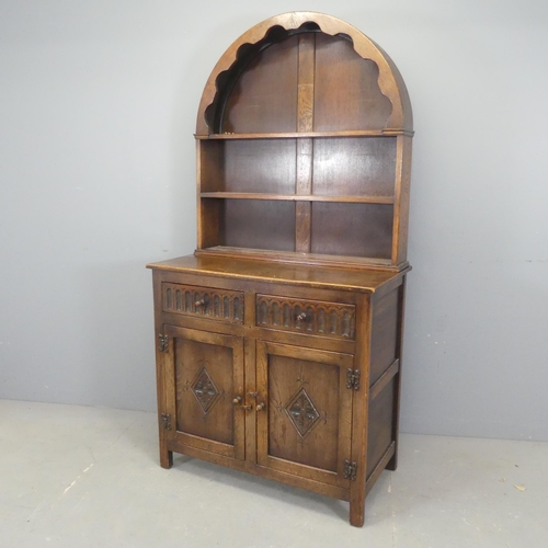 2546 - An early 20th century oak two-section dome-topped dresser. Width 91cm, height 180cm, detth 49cm.