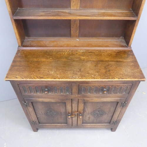 2546 - An early 20th century oak two-section dome-topped dresser. Width 91cm, height 180cm, detth 49cm.