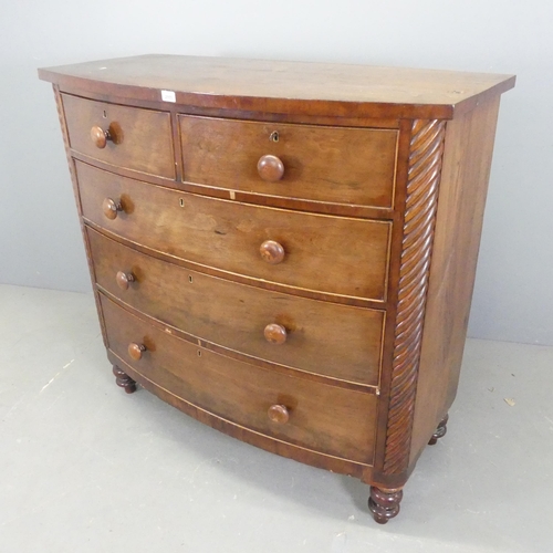 2555 - A Georgian mahogany bow-front chest of two short and three long drawers. W121cm, H116cm, D57cm.