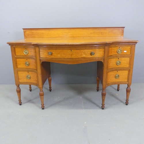 2556 - A Victorian mahogany bow-front kneehole desk, with raised back, seven drawers and satinwood inlaid d... 