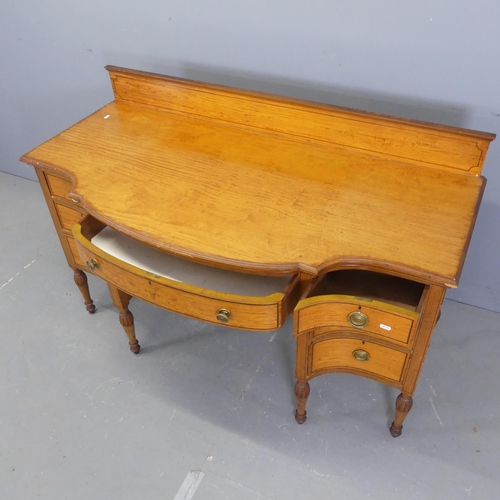 2556 - A Victorian mahogany bow-front kneehole desk, with raised back, seven drawers and satinwood inlaid d... 