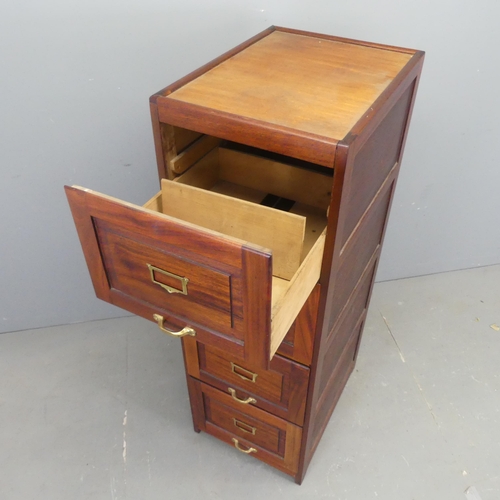 2557 - A mahogany four-drawer filing chest. Width 46cm, height 138cm, depth 62cm.