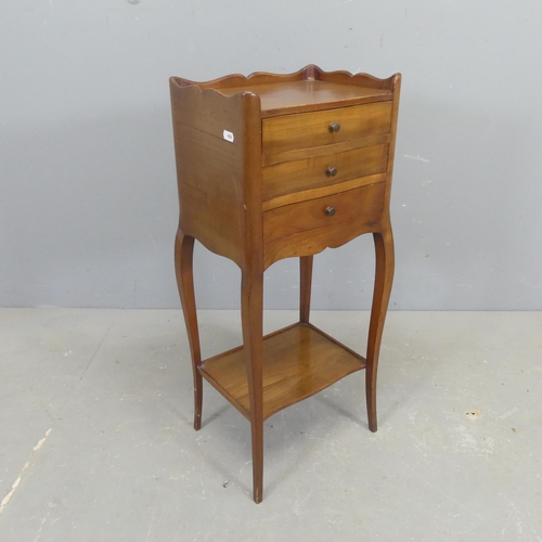 2563 - A French mahogany bedside chest of three drawers, with shelf under and raised on cabriole legs. Widt... 