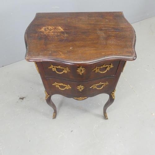 2564 - A continental style mahogany bedside chest of two drawers, with brass mounts and raised on cabriole ... 