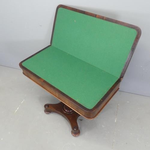 2566 - A 19th century rosewood fold-over card table, raised on tapered octagonal column with platform base.... 