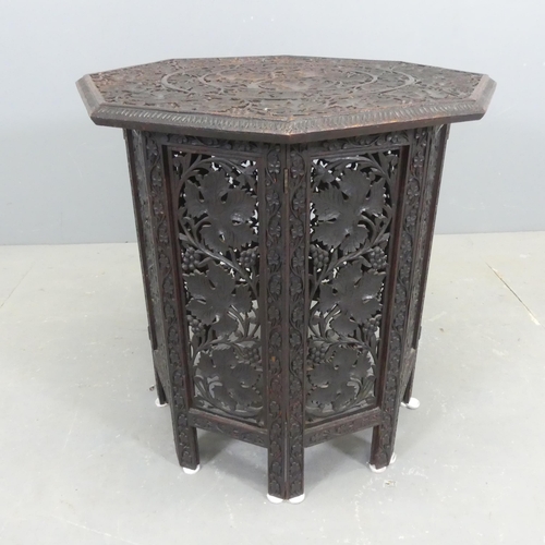 2567 - An Anglo-Indian oak octagonal table, with carved and pierced folate decoration. Width 58cm, height 5... 