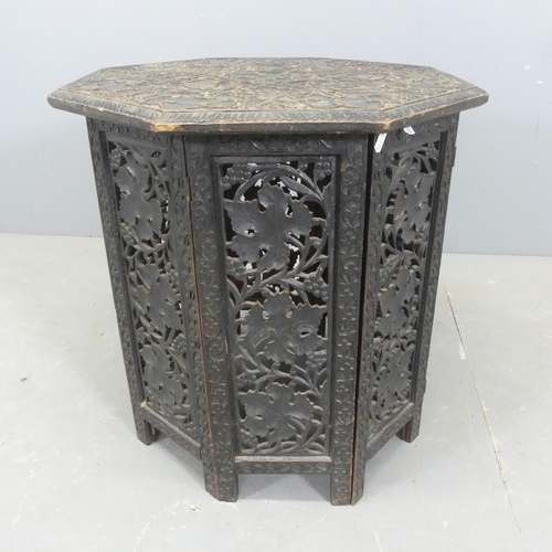 2568 - An Anglo-Indian oak octagonal table, with carved and pierced folate decoration. Width 57cm, height 5... 