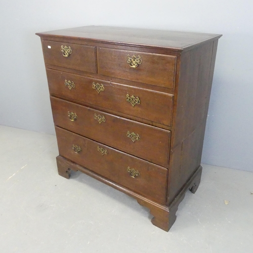 2571 - A Victorian oak two-section chest of two short and three long drawers, raised on bracket feet. Width... 