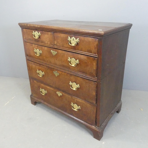 2572 - A Georgian cross-banded walnut two-section chest of two short and three long drawers, with bevelled ... 