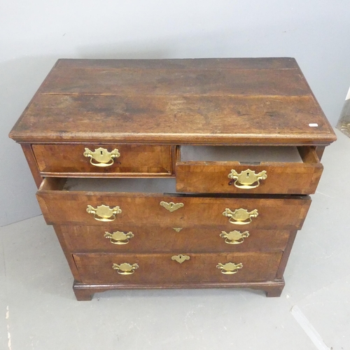 2572 - A Georgian cross-banded walnut two-section chest of two short and three long drawers, with bevelled ... 