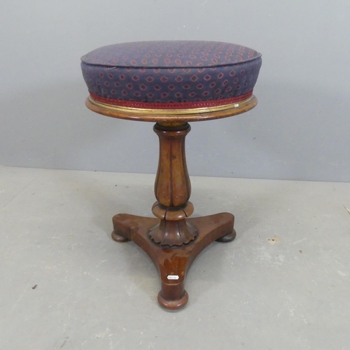 2577 - A Victorian mahogany piano stool, with rise and fall mechanism, turned central column and platform b... 