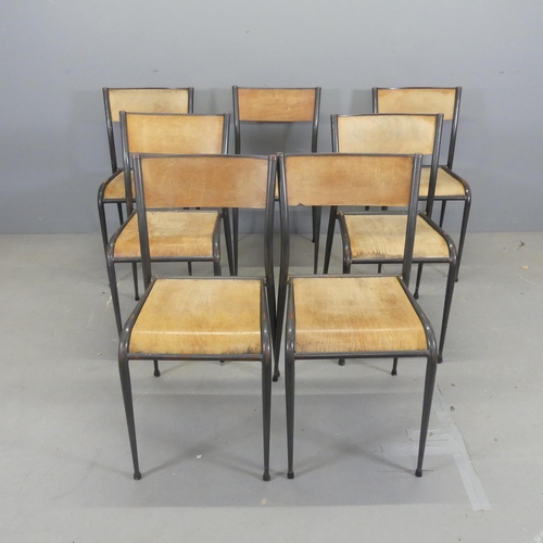 2602 - A set of seven stacking chairs, with bent ply seat and back panels on tubular metal frames.