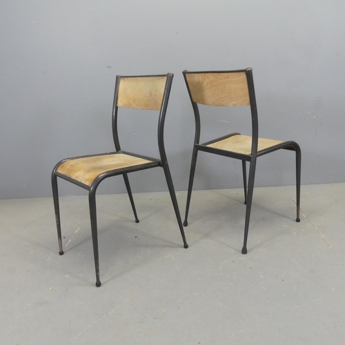 2602 - A set of seven stacking chairs, with bent ply seat and back panels on tubular metal frames.