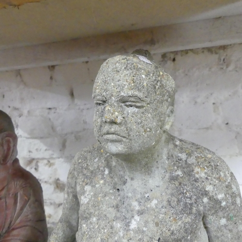 2609 - A painted concrete Buddha statue, height 47cm, and a concrete Sumo wrestler statue. (2)