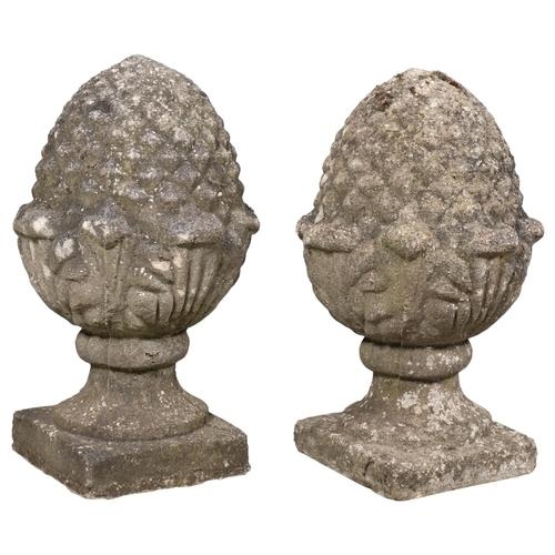 2628 - A pair of weathered concrete pineapple finials. width 34cm, height 57cm.