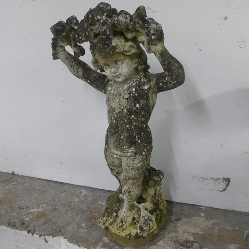 2635 - A weathered concrete garden statue, study of a cherub holding a garland. Height 93cm.