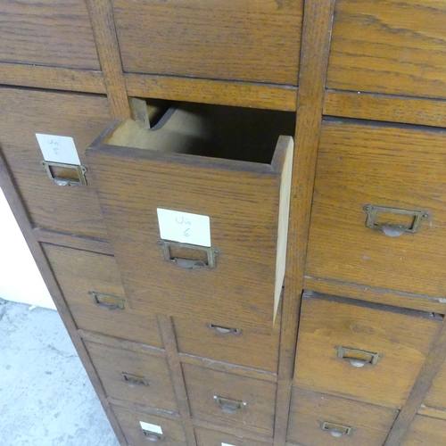 2645 - A vintage French oak notaire cabinet, with 28 drawers. Width 82cm, height 180cm, depth 36cm.