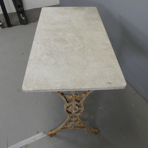 2660 - A rectangular marble topped garden table on painted cast iron frame. Length 107cm, height 72cm, widt... 