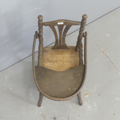 2662 - A French oak metamorphic doll's high chair.