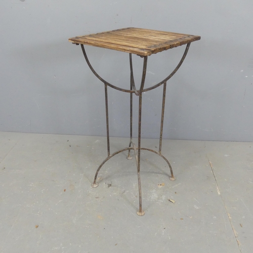 2669 - A vintage slatted pine-topped plant stand on wrought metal base. Width 36cm, height 74cm, depth 38cm... 