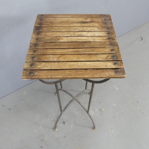 2669 - A vintage slatted pine-topped plant stand on wrought metal base. Width 36cm, height 74cm, depth 38cm... 