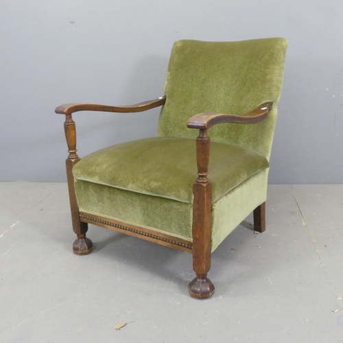 2675 - An early 20th century oak and upholstered parlour open arm chair.