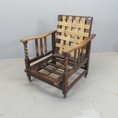 2677 - An early 20th century oak metamorphic plantation chair / lounger, with adjustable back and lifting s... 