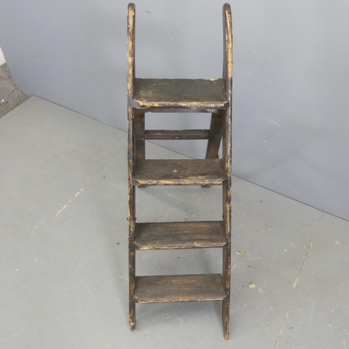 2679 - A vintage stained pine step ladder. Height 114cm (deployed).