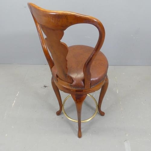 2682 - A mahogany and studded faux leather upholstered swivel bar stool in the Georgian style, with brass f... 