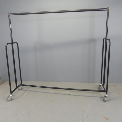 2684 - A painted tubular metal industrial clothes rail. Length 185cm, height 166cm.