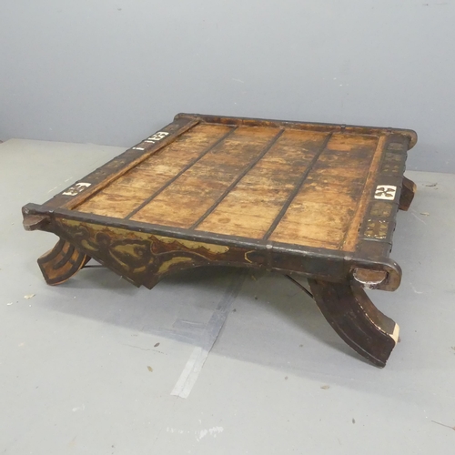 2686 - An Moroccan hardwood and metal bound square-topped low table. Width 130cm, height 36cm.