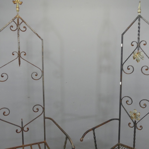 2701 - Two similar wrought iron garden throne chairs. Tallest 182cm.