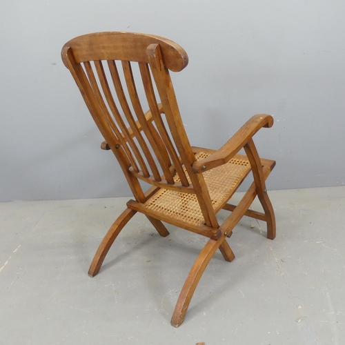 2706 - A folding cane seated steamer chair, inscribed 