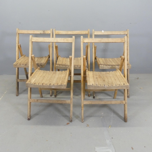 2708 - A set five teak folding chairs.