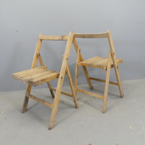 2708 - A set five teak folding chairs.