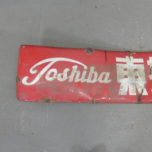 2710 - A Japanese vintage enamelled Toshiba advertising sign. Width 183cm, height 30cm.