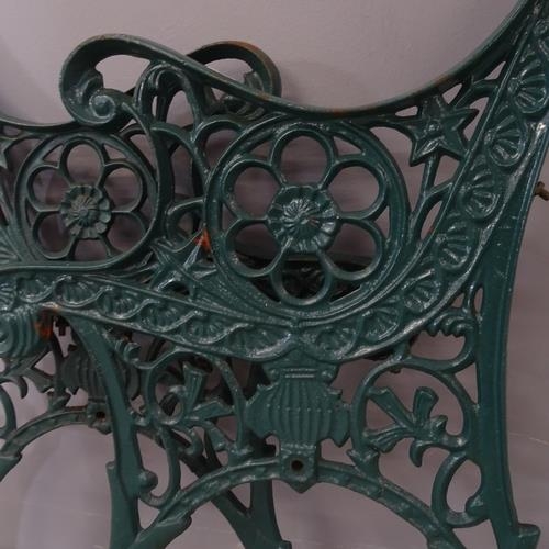 2712 - A pair of painted cast iron bench ends. Height overall 72cm.