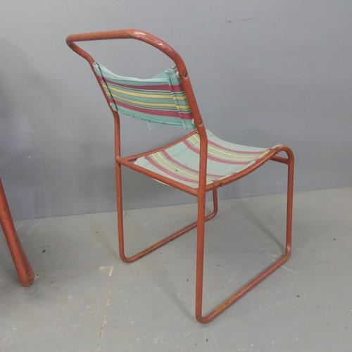 2714 - A set of six mid-century stacking chairs, with sling seats on tubular metal frames.