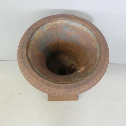 2724 - A cast-iron two-section Campana style urn on stand. D30cm, H50cm.