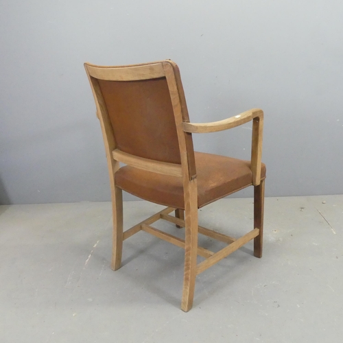 2736 - A French oak and faux-leather upholstered open arm bridge chair.