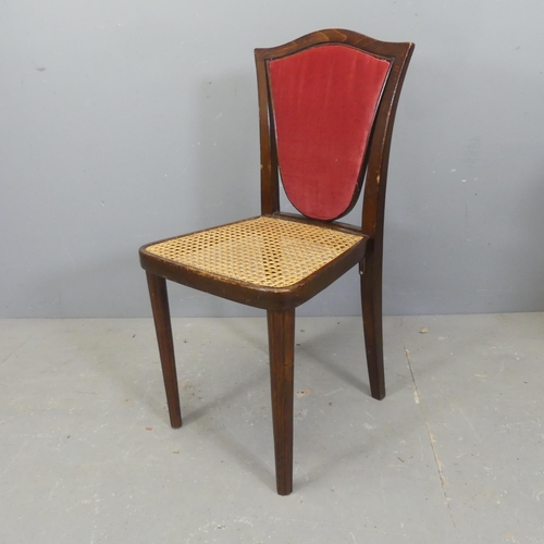 2738 - An early 20th century Thonet bentwood chair of unusual shield back form with cane seat and reeded fr... 