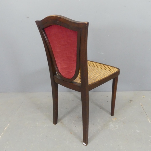 2738 - An early 20th century Thonet bentwood chair of unusual shield back form with cane seat and reeded fr... 