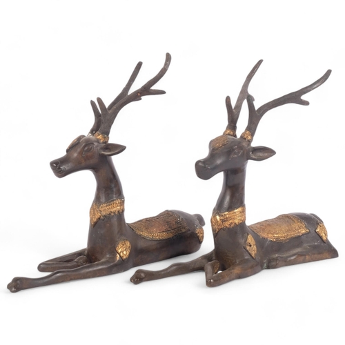 101 - A pair of bronze and partial parcel-gilded recumbent deer, H28cm