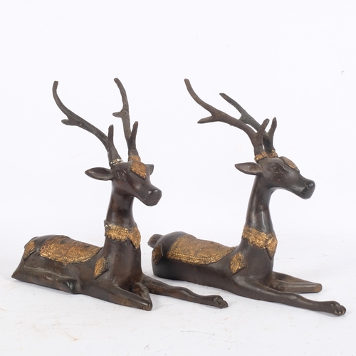 101 - A pair of bronze and partial parcel-gilded recumbent deer, H28cm