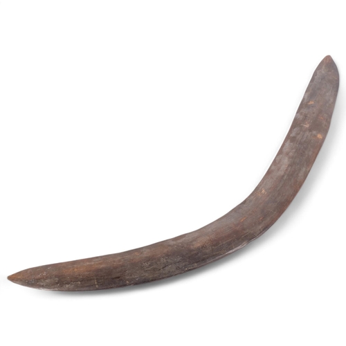 125 - An Australian Aboriginal boomerang, 65cm